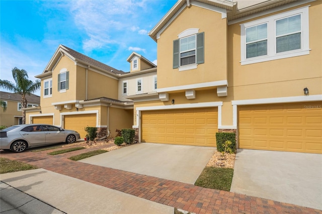 multi unit property featuring a garage