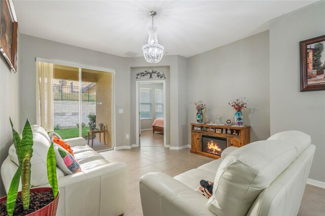 17523 Promenade Dr, Clermont, FL 34711 - living room with an inviting chandelier and light tile patterned floors
