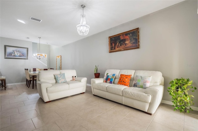 17523 Promenade Dr, Clermont, FL 34711 - living room with light tile patterned floors and a notable chandelier