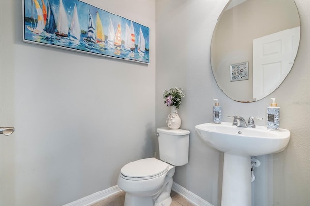 17523 Promenade Dr, Clermont, FL 34711 - bathroom with sink, tile patterned floors, and toilet