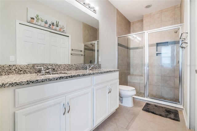 17523 Promenade Dr, Clermont, FL 34711 - bathroom with vanity, toilet, and a shower with shower door