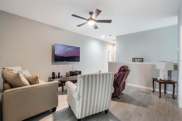 17523 Promenade Dr, Clermont, FL 34711 - living room with light hardwood / wood-style flooring and ceiling fan