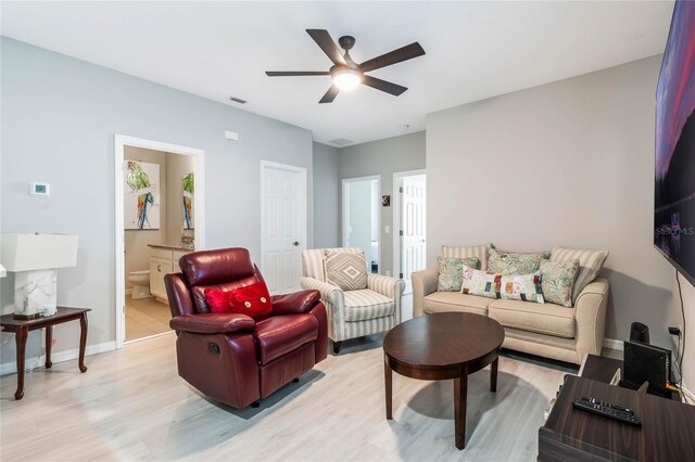 17523 Promenade Dr, Clermont, FL 34711 - living room with light hardwood / wood-style flooring and ceiling fan