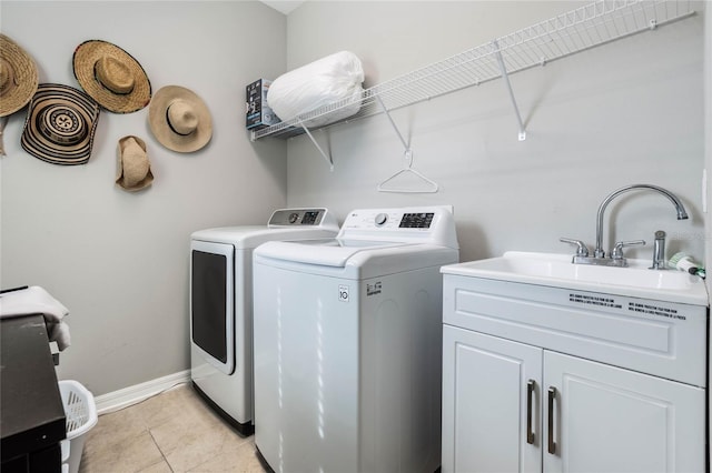 17523 Promenade Dr, Clermont, FL 34711 - laundry room with cabinets, separate washer and dryer, and light tile patterned floors