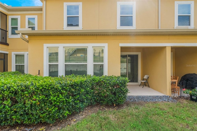 17523 Promenade Dr, Clermont, FL 34711 - back of house with a patio area