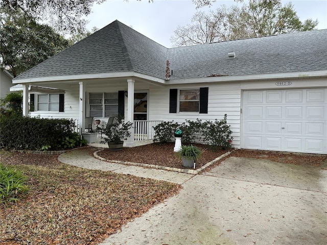 view of front facade with a garage and covered porch