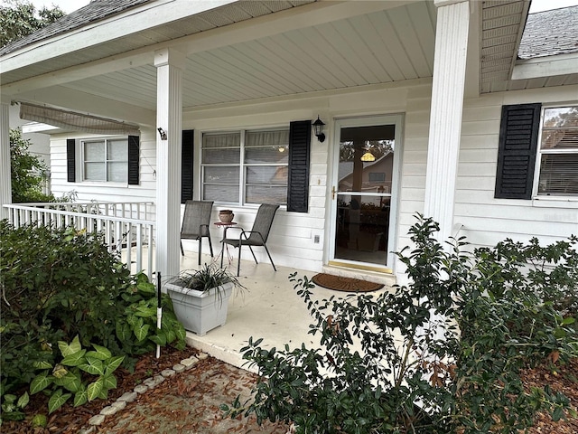 entrance to property featuring a porch