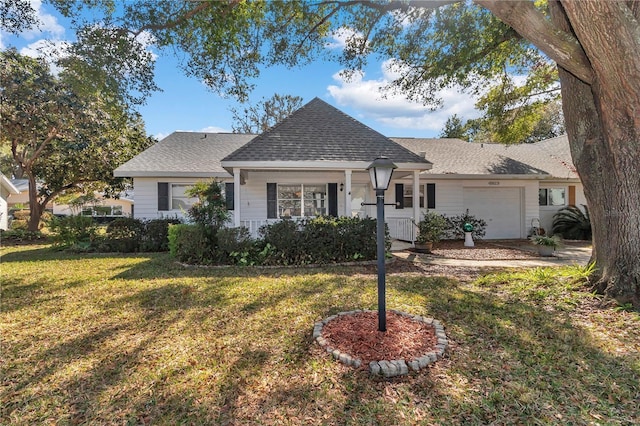 ranch-style house with a garage and a front lawn