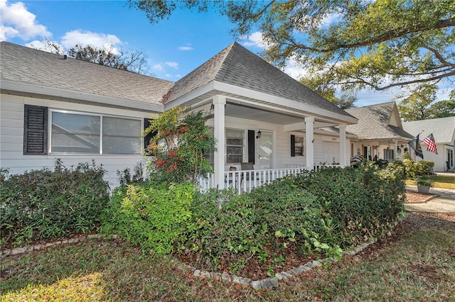 view of front facade with a porch and a garage