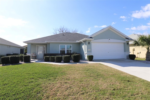 ranch-style home with a garage and a front lawn