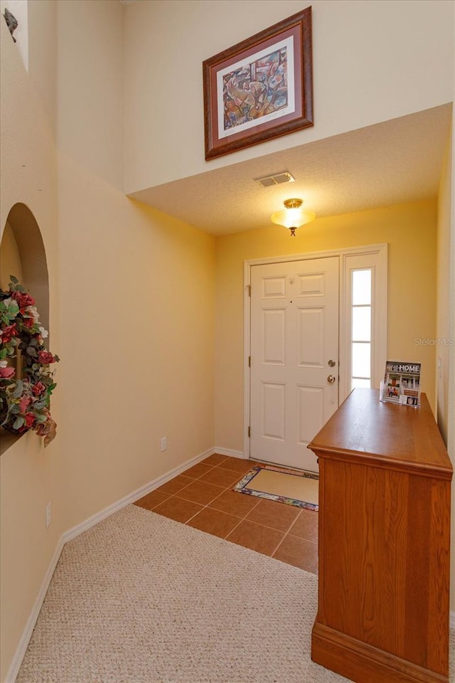 entryway with tile patterned flooring