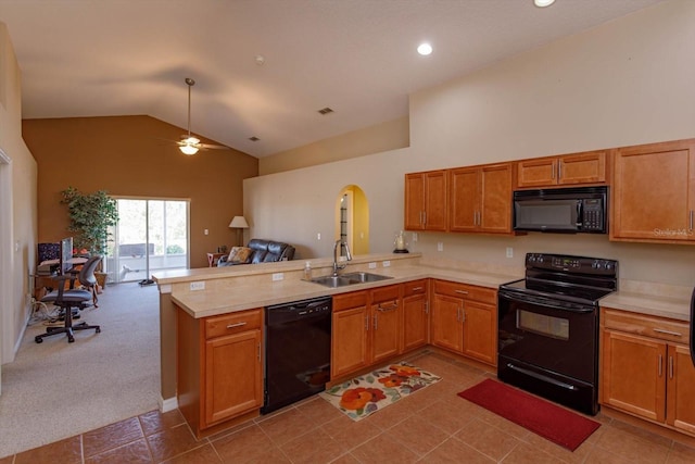 kitchen with high vaulted ceiling, black appliances, sink, light colored carpet, and kitchen peninsula