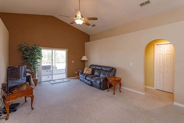 living area featuring light carpet, high vaulted ceiling, and ceiling fan