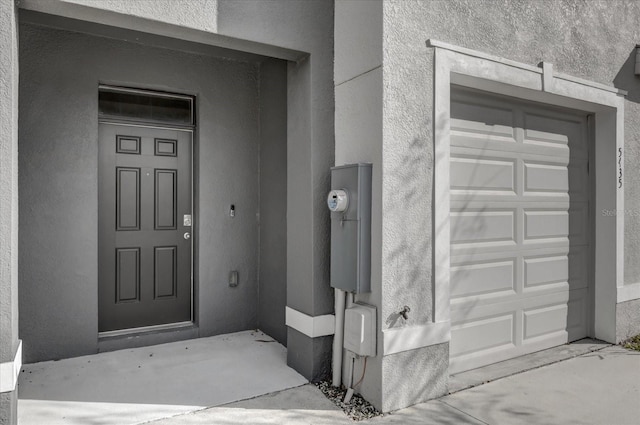 entrance to property featuring a garage