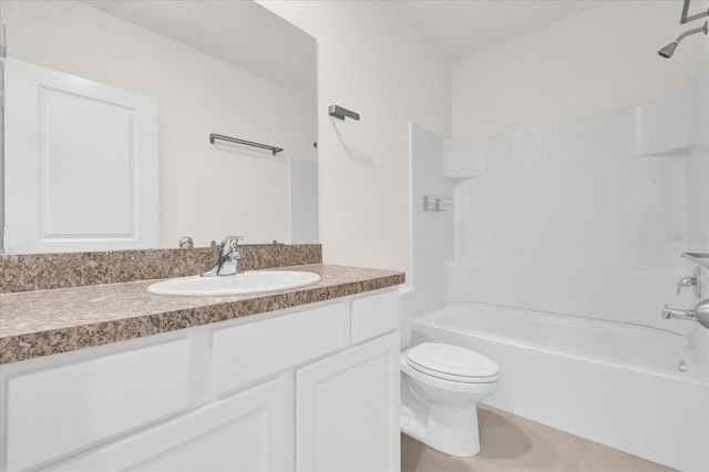 full bathroom featuring vanity, tile patterned floors, toilet, and washtub / shower combination