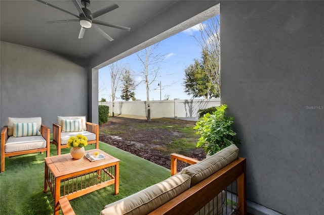 view of patio with ceiling fan and an outdoor hangout area