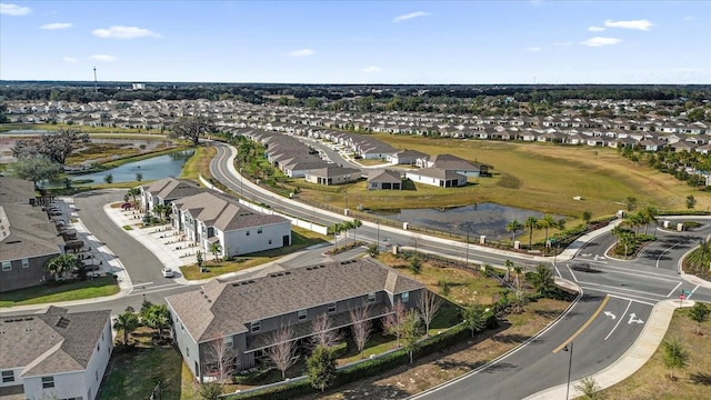 aerial view with a water view and a residential view