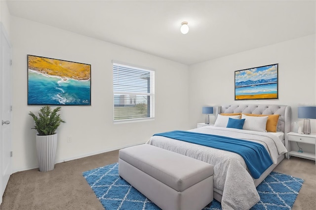 bedroom with carpet flooring and baseboards