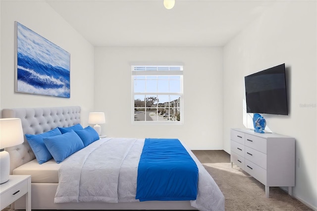 bedroom featuring light colored carpet