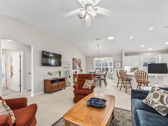 living room with light tile patterned flooring, lofted ceiling, and ceiling fan with notable chandelier