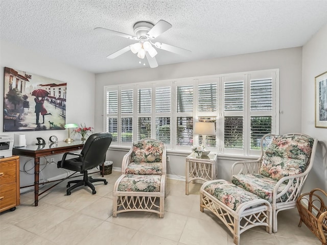 office featuring light tile patterned floors, a textured ceiling, and ceiling fan