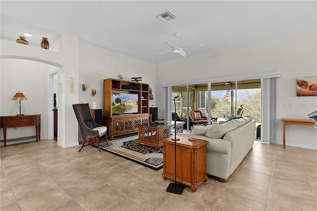 living room with light tile patterned floors and ceiling fan