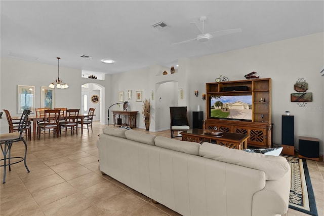 tiled living room with ceiling fan