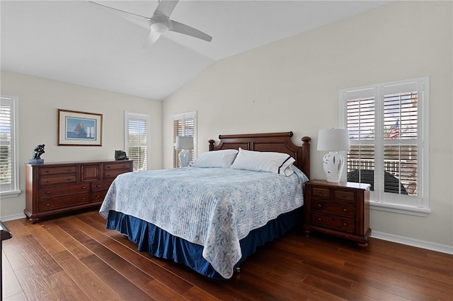 bedroom with lofted ceiling, dark hardwood / wood-style floors, and ceiling fan