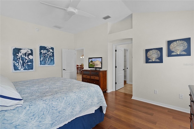 bedroom featuring vaulted ceiling, ceiling fan, and dark hardwood / wood-style flooring