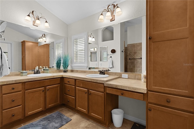 bathroom featuring lofted ceiling and vanity