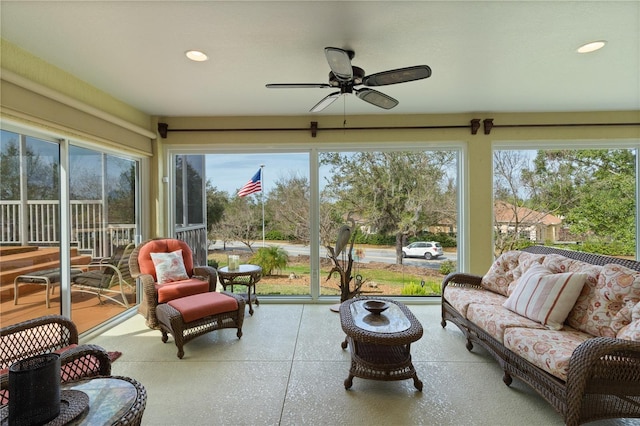 sunroom with ceiling fan