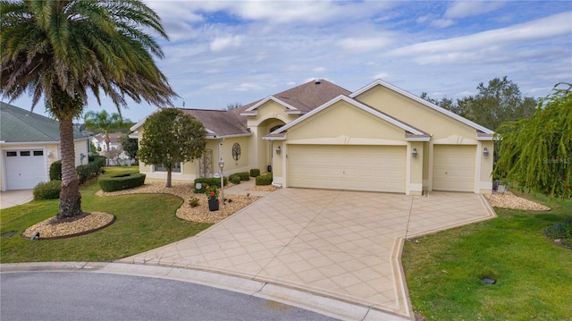 single story home with a garage and a front yard