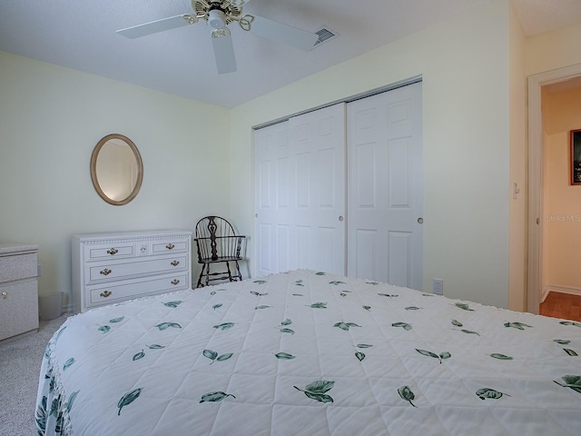 bedroom featuring ceiling fan and a closet