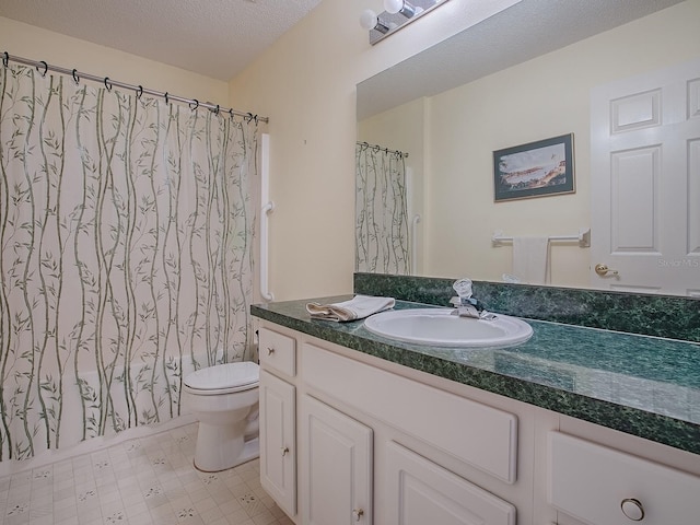 full bathroom with vanity, a textured ceiling, shower / bath combination with curtain, and toilet