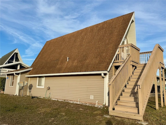 10301 US Highway 27 Unit 16, Clermont, FL 34711 - back of property with roof with shingles, stairs, and a wooden deck