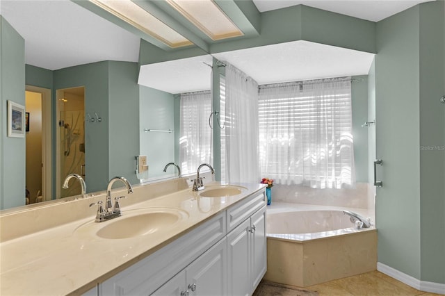 bathroom featuring vanity, tile patterned flooring, and a tub