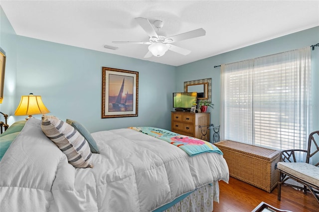 bedroom featuring ceiling fan and light hardwood / wood-style flooring