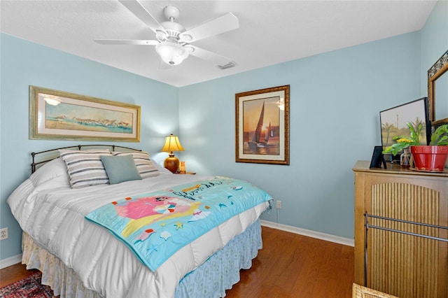 bedroom featuring ceiling fan and dark hardwood / wood-style flooring