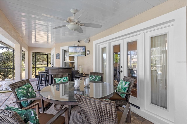 sunroom with french doors and ceiling fan