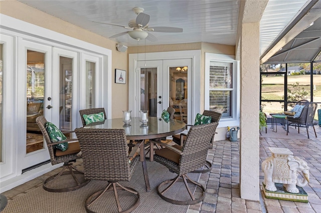 sunroom with ceiling fan and french doors