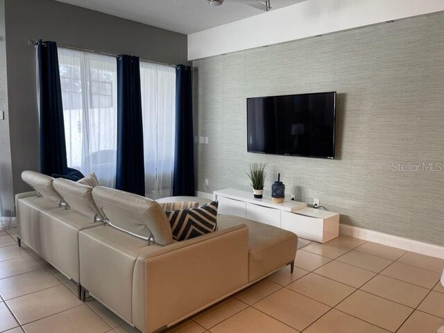 294 Captiva Dr, Davenport, FL 33896 - living area featuring light tile patterned floors and baseboards