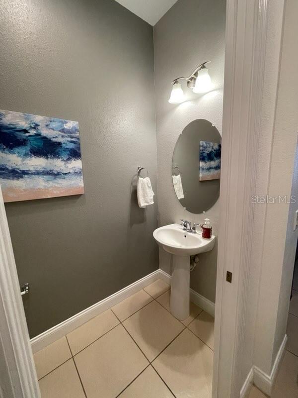 294 Captiva Dr, Davenport, FL 33896 - bathroom with tile patterned floors and baseboards