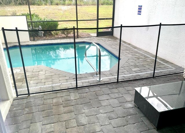 294 Captiva Dr, Davenport, FL 33896 - view of pool with glass enclosure and a patio area