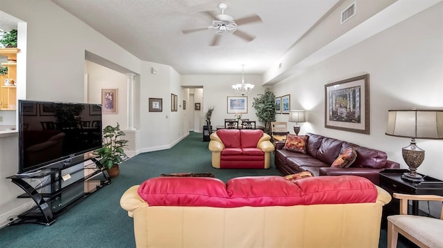 living room with carpet flooring, ceiling fan with notable chandelier, and a textured ceiling