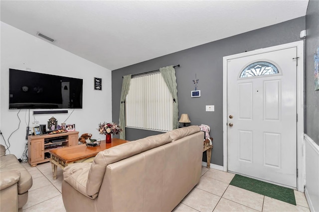 tiled living room with lofted ceiling