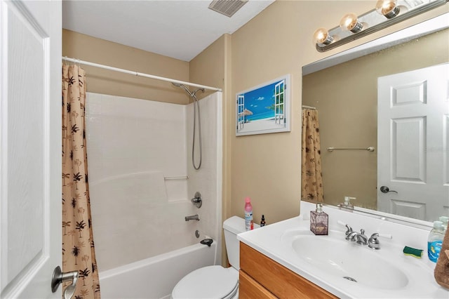 full bathroom with vanity, shower / bath combo with shower curtain, and toilet