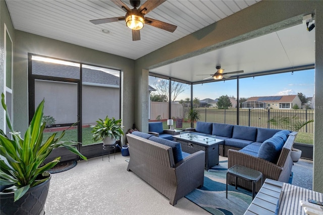 sunroom / solarium with ceiling fan