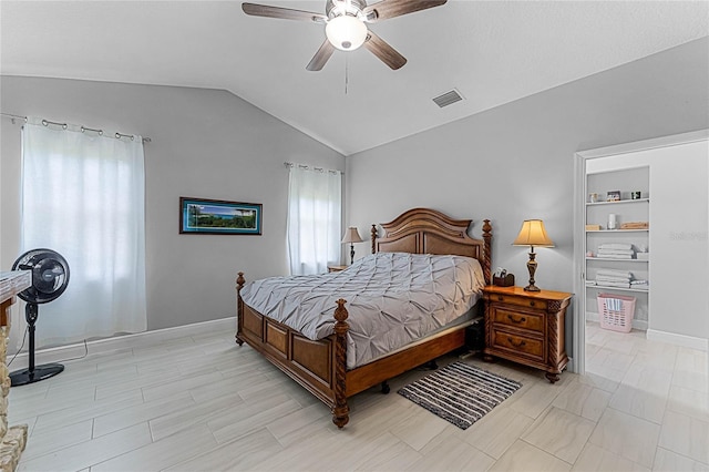 bedroom with lofted ceiling and ceiling fan