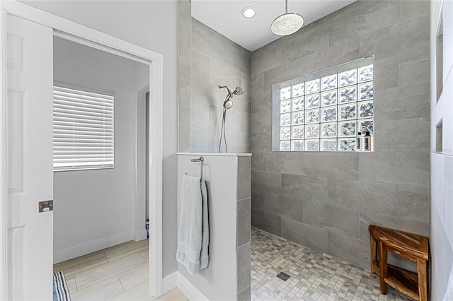 bathroom featuring a tile shower