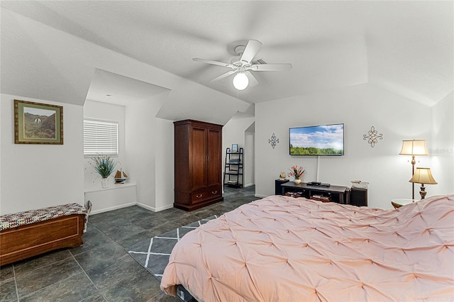 bedroom featuring ceiling fan and lofted ceiling